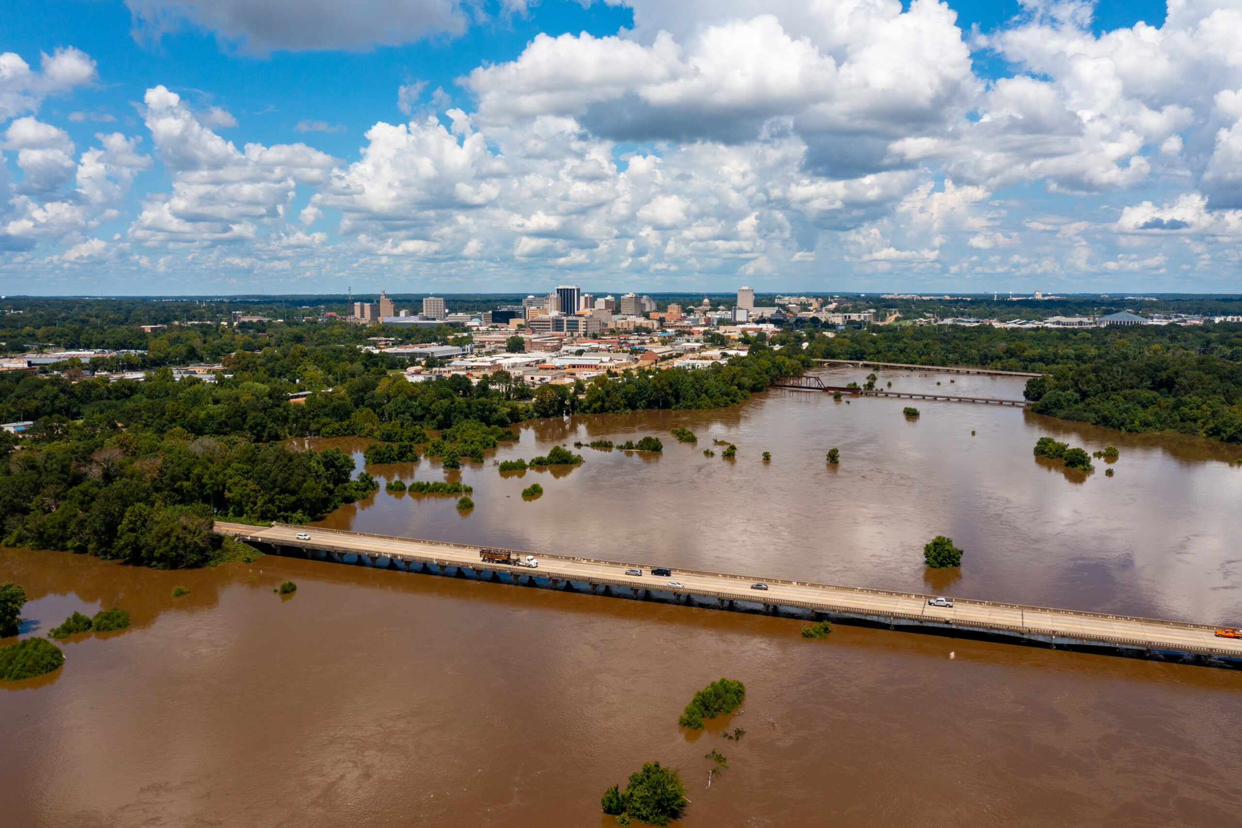 Jackson, MS Skyline with flooding Pearl River in the foreground in August 2022