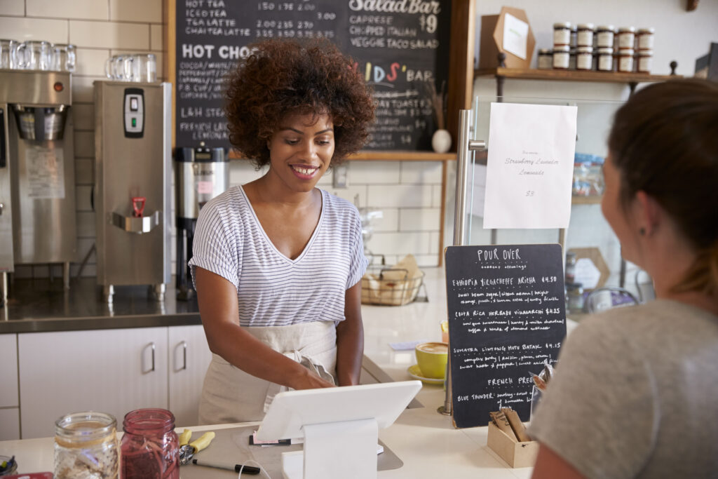 Waitress taking a customer's order at a coffee shop